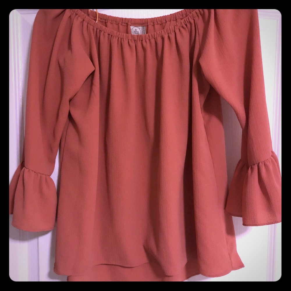 Peachy colored off the shoulders top.